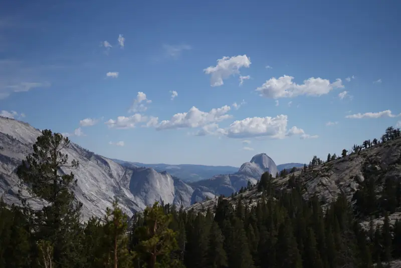 A still lake in Yosemite under a deep blue sky